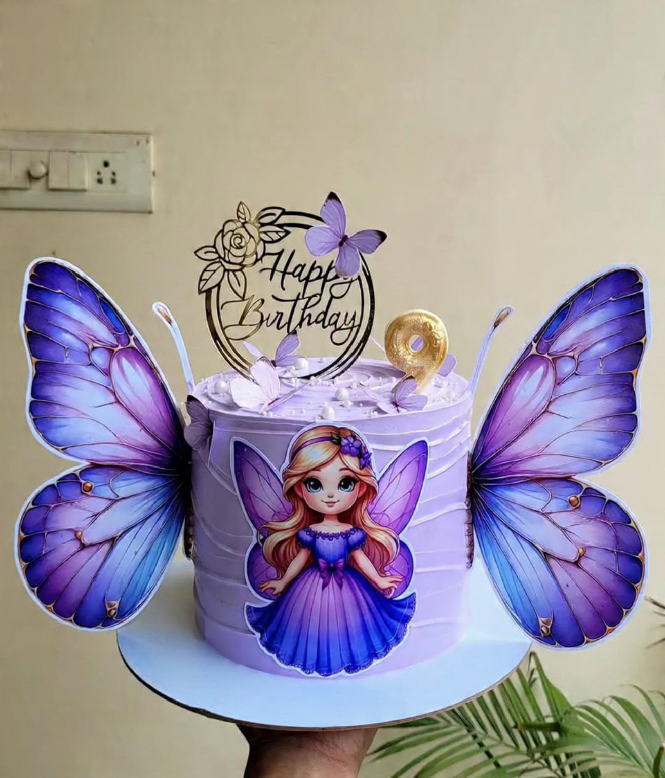 Lavanya Homemade Cakes butterfly-themed celebration cake with floral details