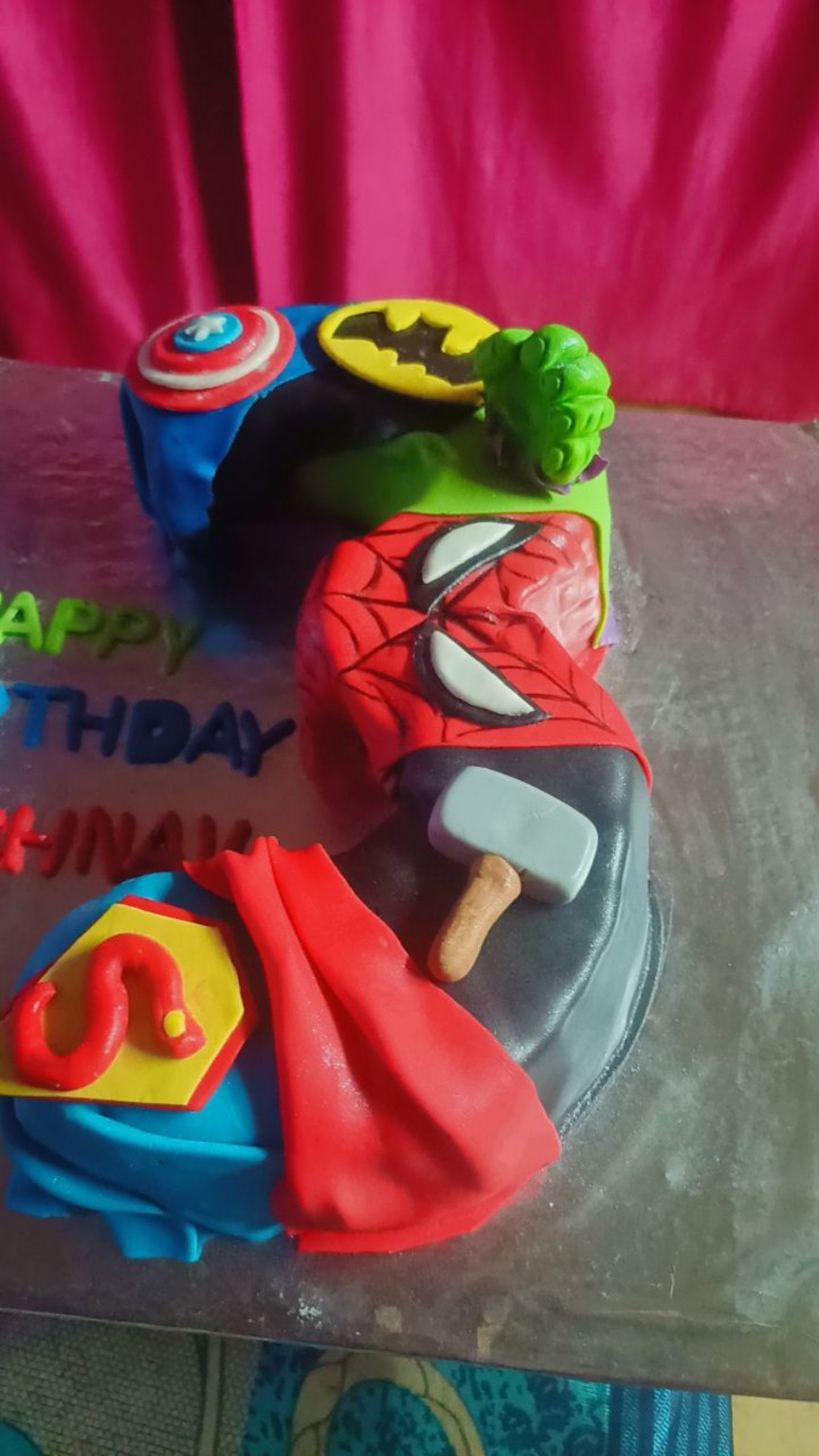 Colorful superhero themed custom cake